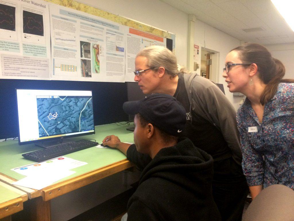 (right to left) Rah Smith, urban studies and planning major, Ben Discoe, mapping instructor, and Aiko Weverk, IGIS associate director explore different applications of crowd-mapping at the Institute for Geographic Information Sciences first marathon at SF State Wednesday Nov. 18, 2015. (Brian Grabianowski / Xpress)