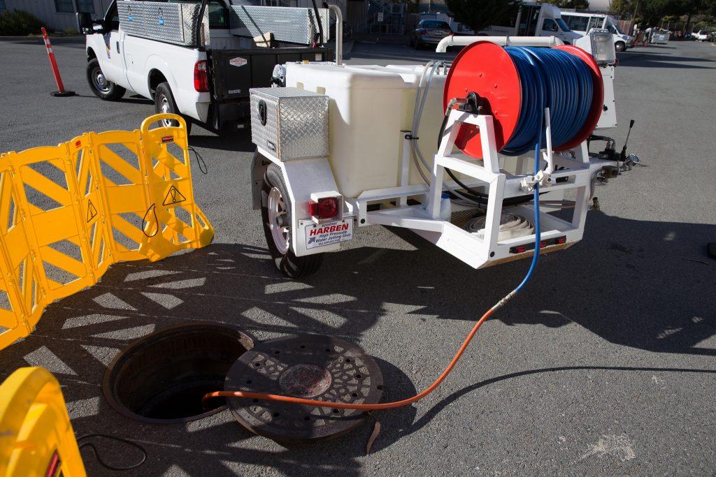 SF State utilizes a high pressure pipe jetting system, shown in the Corporation Yard on Monday, Nov. 16, 2015, to clear clogs in storm and sewer drains. The system uses a diesel engine to pressurize water to 4,000 pounds per square inch, which drives the hose and head into the pipe and breaks up the blockage.  (Brian Churchwell / Xpress)