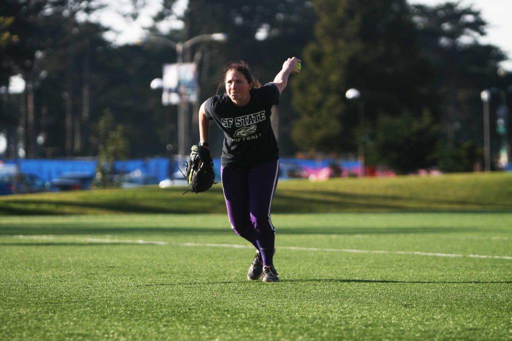 Megan Clark (17) pitches at SF State Gators softball team practice Tuesday, Feb. 2, 2016. The Gators open the season at home with a double-header against Northwest Nazarene University on Feb 12 at 1 p.m. (James Chan / Xpress)