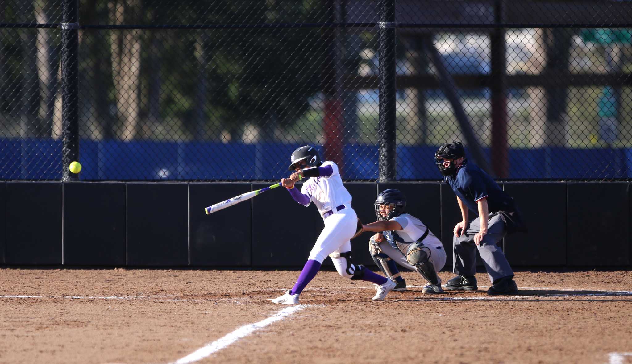 SF State Gators women softball team Madison Collins (13) makes a strike during the second doubleheader softball game against Cal State San Bernardino. SF State won 8-2 over Cal State San Bernardino on Saturday, February 20, 2016. (Perng-chih Huang / Xpress) 