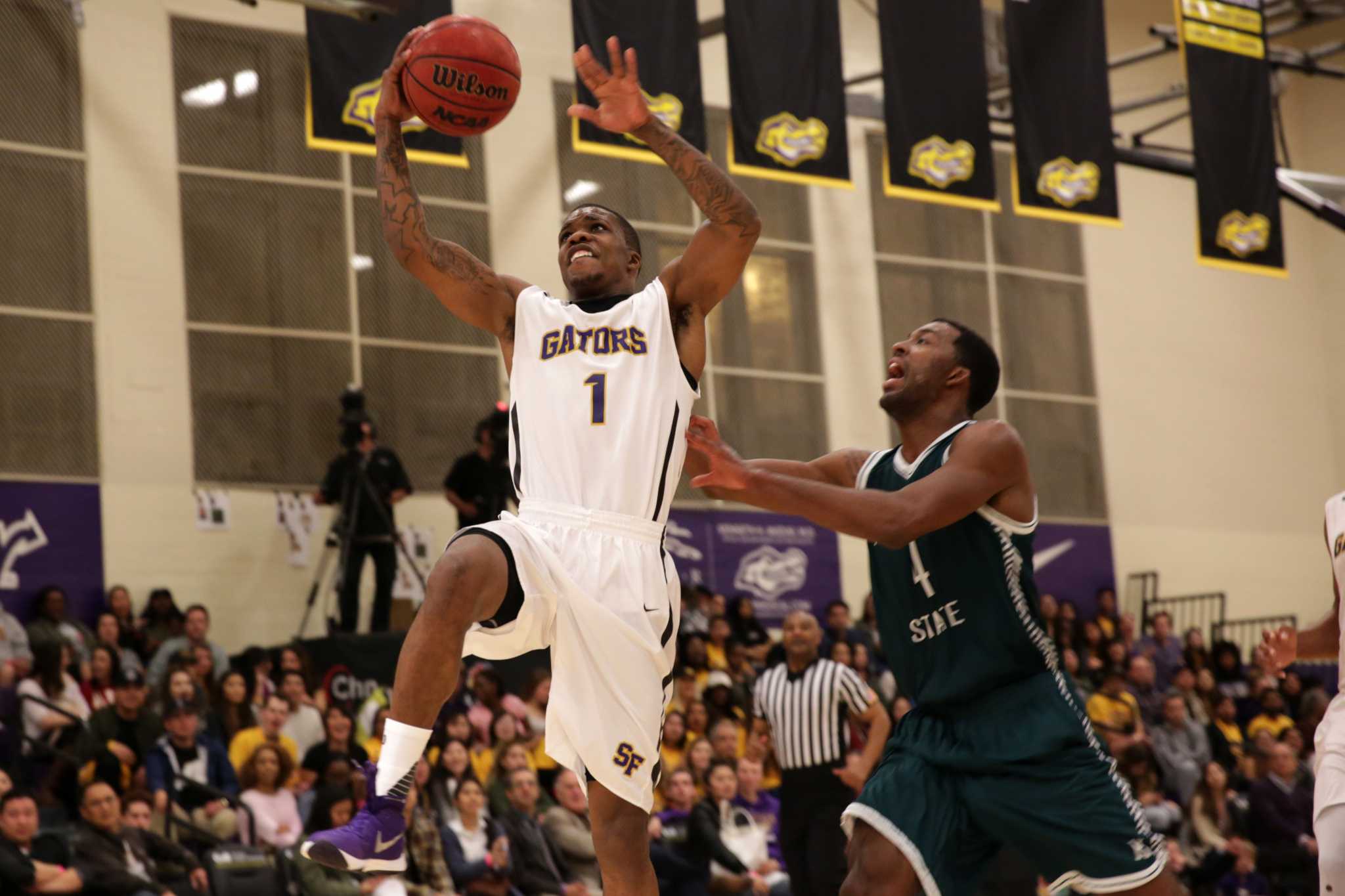 SF State Gators’ guard Warren Jackson (1) makes a charge towards the basket in the first half of a game against the Humboldt State Lumberjacks at The Swamp at SF State on Friday, Feb. 5, 2016. The Gators won 85-59.( Ryan McNulty / Xpress )