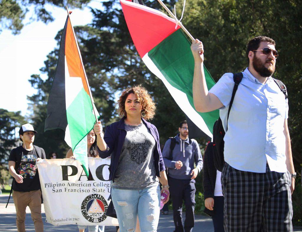 General Union of Palestine Students members are joined by the Pilipino American Collegiate Endeavor Tuesday, Feb. 23, as they march from Malcolm X Plaza to the Ethnic Studies and Psychology Building. (Lauren Saldana / Special to Xpress)