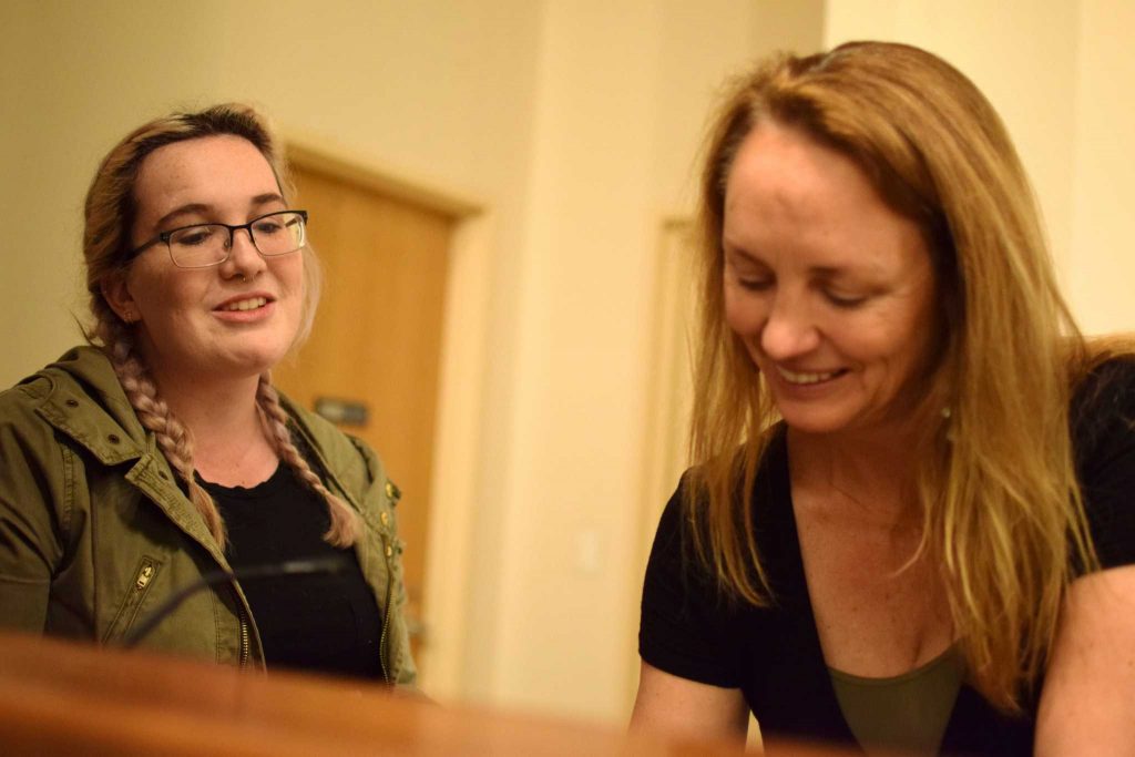 Current SF State student, Sam Burgert asks Jan Ellison to sign her copy of A Small Indiscretion on Monday, February 29 in the Humanities Auditorium. (Eric Chan / Xpress)