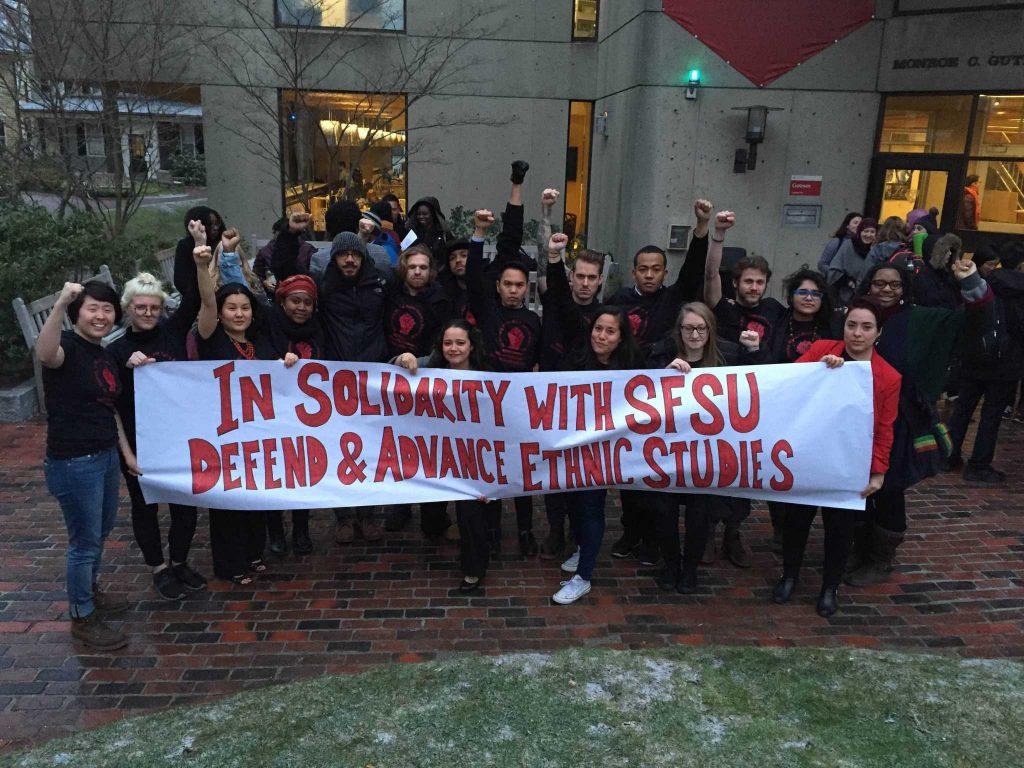 Harvard Graduate School of Education students pose with a banner they made in support of the SF State College of Ethnic Studies. (Photo courtesy of Christina Villarreal)