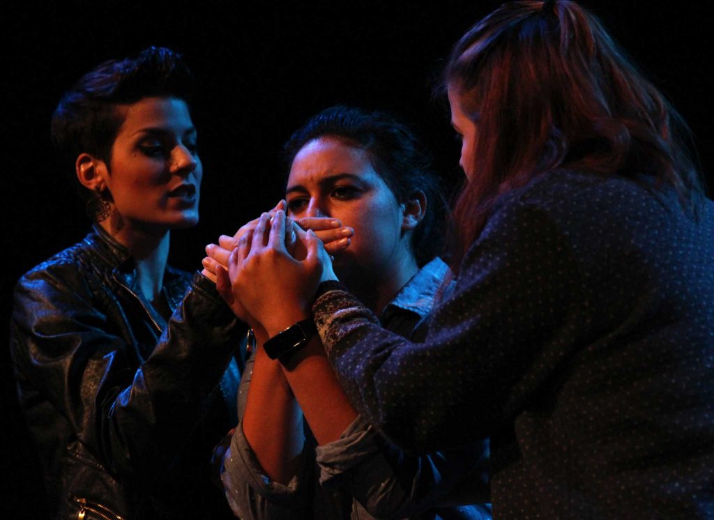 Theater art students Desiree Juanes (left) portraying Ashley, Roni Espinoza (middle) portraying Maria, and Sara Witsch (right) portraying Willa rehearse for a play called COMM 150 on Monday, Apr. 4. (Alex Kofman / Xpress) 