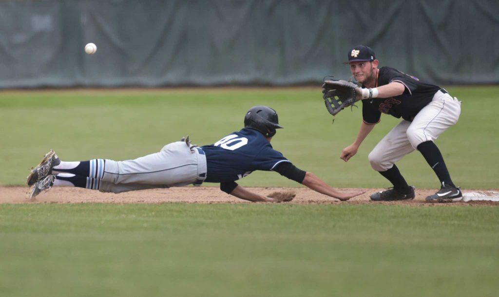 SF State Gators infielder Bryce Brooks (39) tries to tag as Sonoma State Seawolves outfielder Bryant Cid (40) slides back to second base during the game in Gators 4-11 loss at SF States baseball field Friday, May 6. (Qing Huang/Xpress)