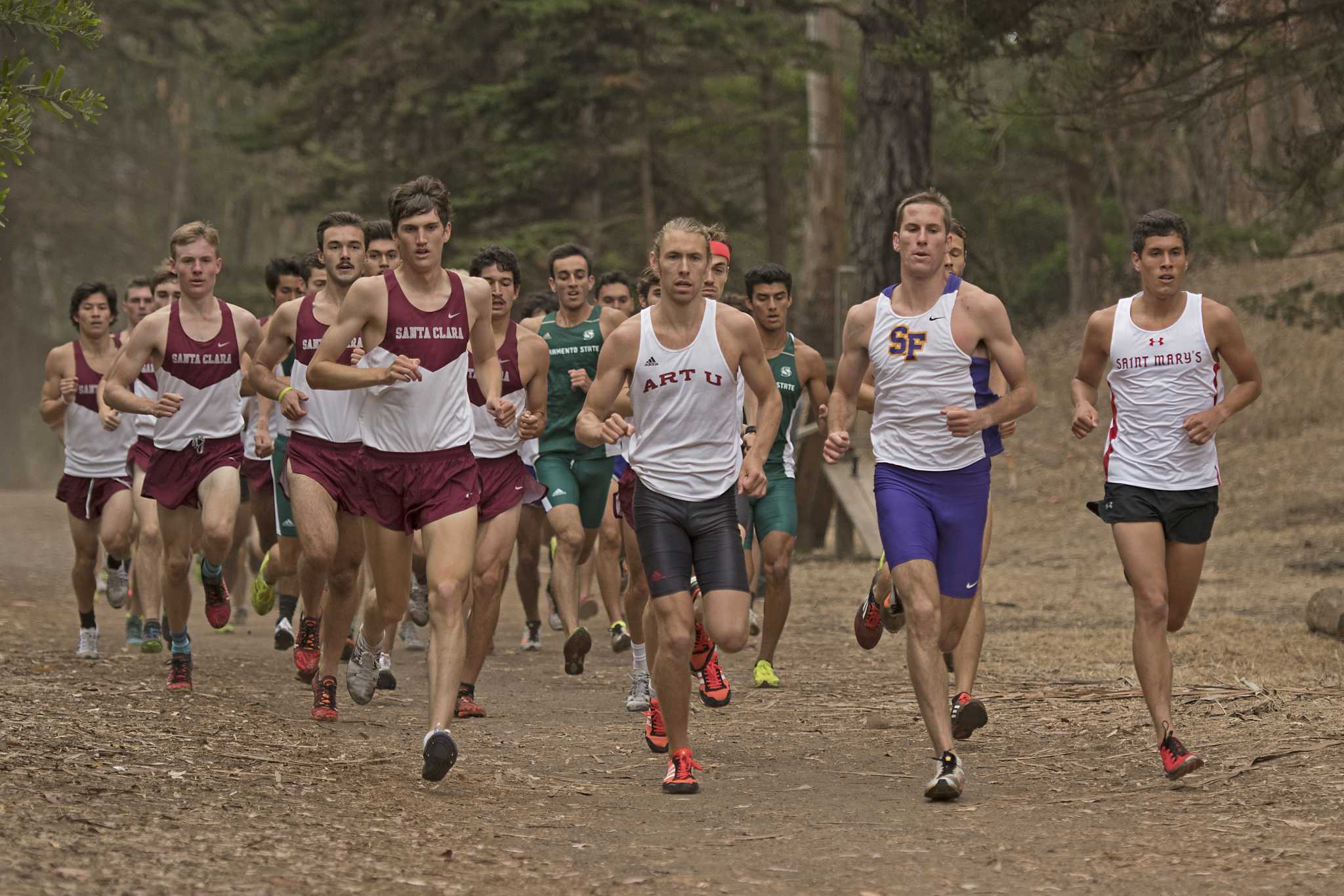 SF State Gators junior Drew Feldman leads the race during the second loop of the 7250 meter race at Hellman Hallow Meadow in Golden Gate Park on Thursday, Sept. 15, 2016. Feldman finished the race in 4th place with a time of 23:18.00.