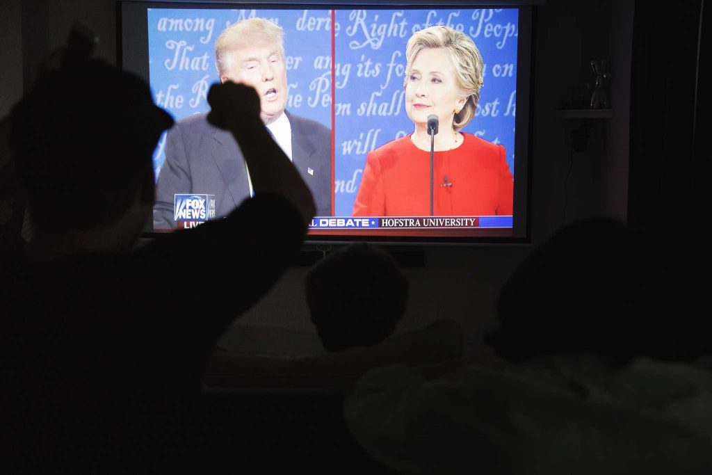 Members of SF State republican student union watch the first presidential debate between Donald Trump and Hillary Clinton in a house at Parkmerced on Monday, Sept. 26, 2016.