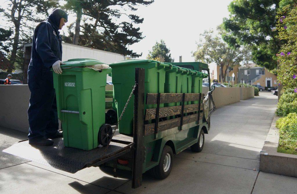 SF State’s Integrated Waste Management employee Eric Igtanloc moves compost

bins in front of the Administration Building on Tuesday, Sept 27, 2016.