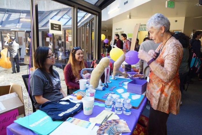 SF State students Evelyn Eung (left) and Lauren Diez (right) teach Secual health at
one of the booths at SF States Student Health Services open house event on
Wednesday, Oct 19, 2016. The open house was a way to promote healthy living and educate students on what health services are provided to them on campus. (Perng-chih Huang/Xpress)
