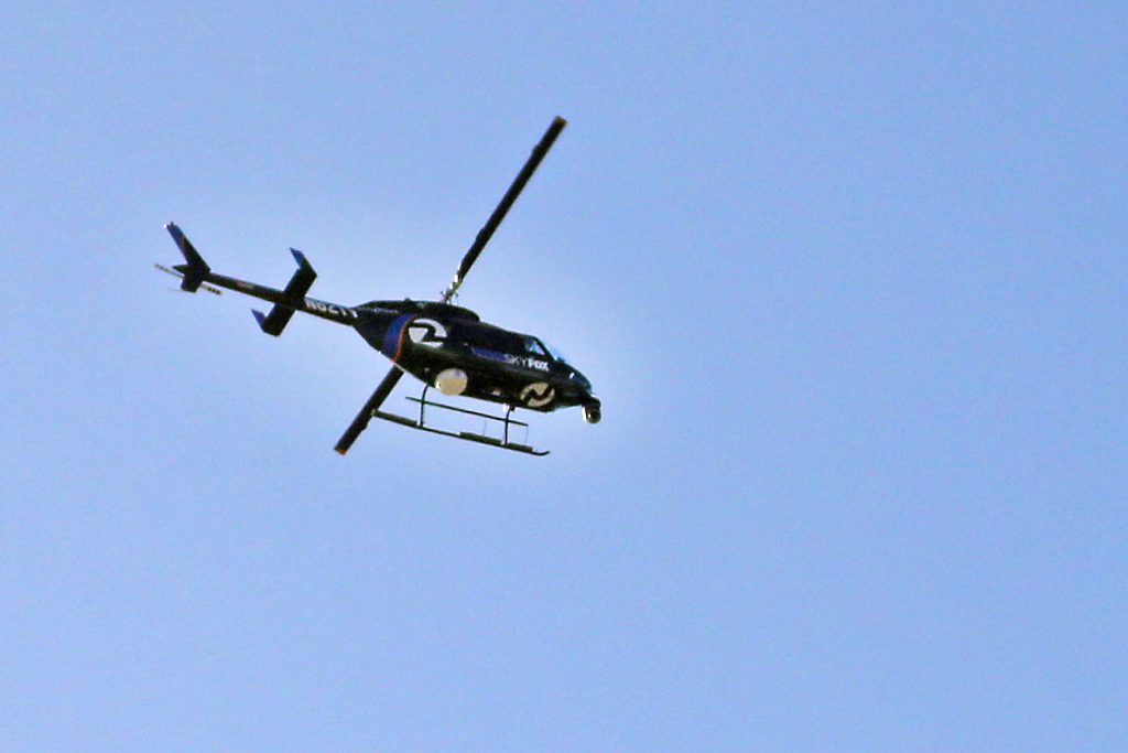 A SkyFOX helicopter hovers over Malcolm X Plaza for the pro-white group Identiy Evropa event titled No Sanction on Monday, Oct. 17, 2016. The group did not arrive after posting a Twitter post about their proposed gathering. (George Morin/Xpress)