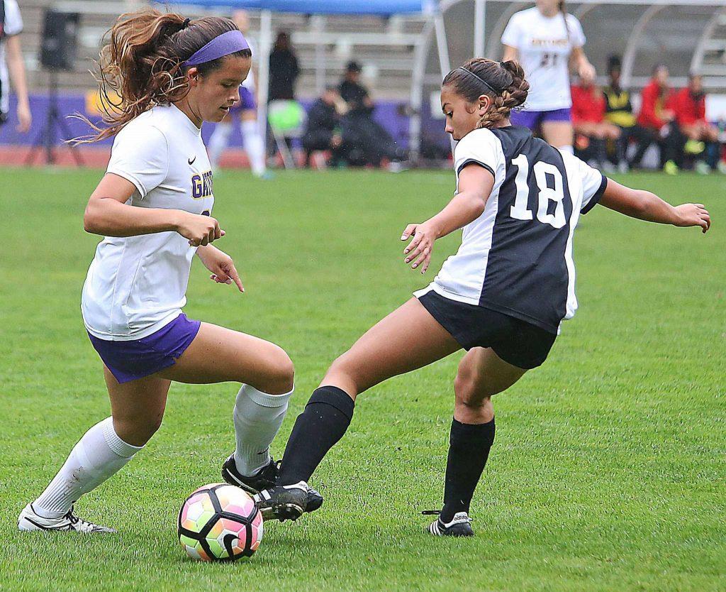SF State Gators’ freshman defender Kelsey Wetzstein (24) battles for control of the ball during their 2-1 loss to the Cal State East Bay Pioneers at Cox Stadium on Thursday, Oct. 27, 2016.