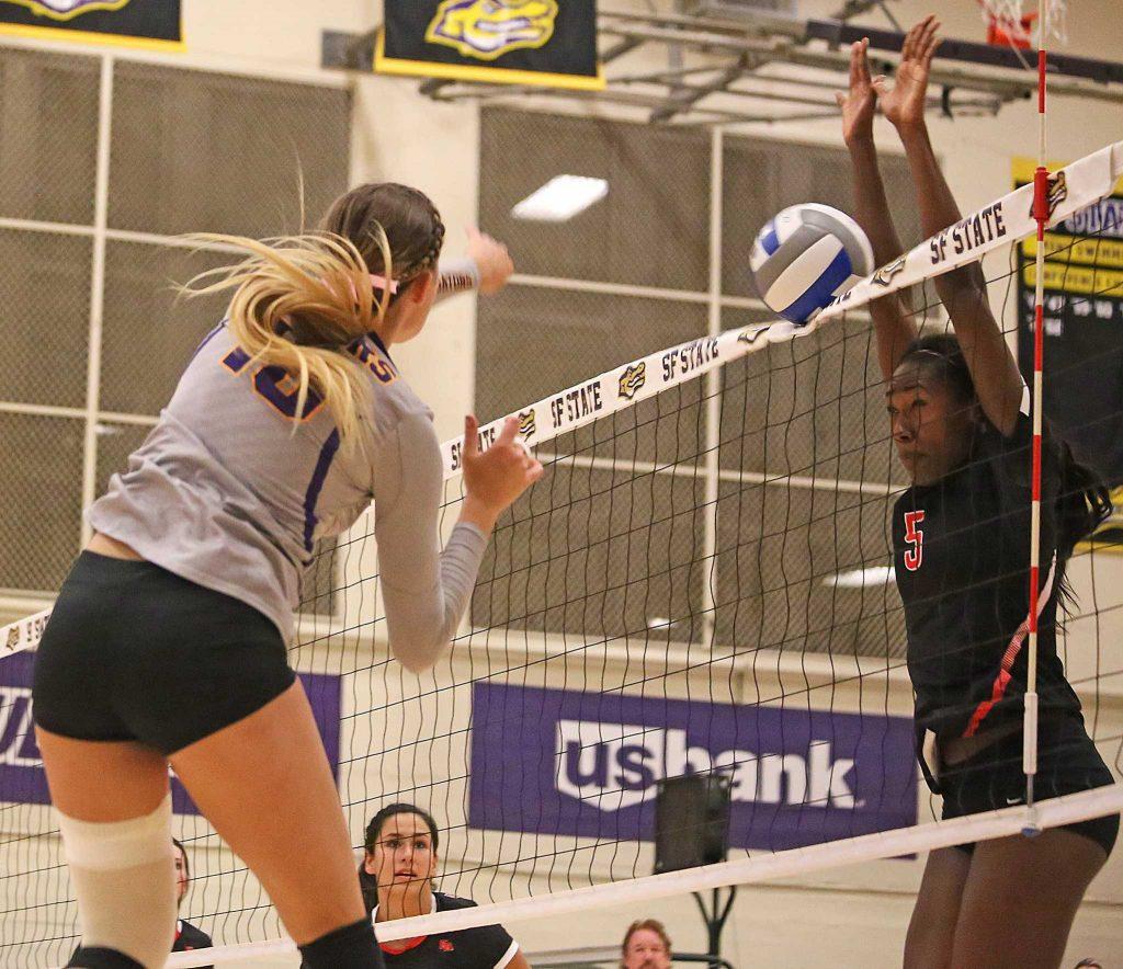 SF State Gators’ outside hitter Christine Johnson (18) fires the ball into the net during their loss to Cal State East Bay on Friday, Oct. 21, 2016. The Gators lost three out of the four sets to the Pioneers. 