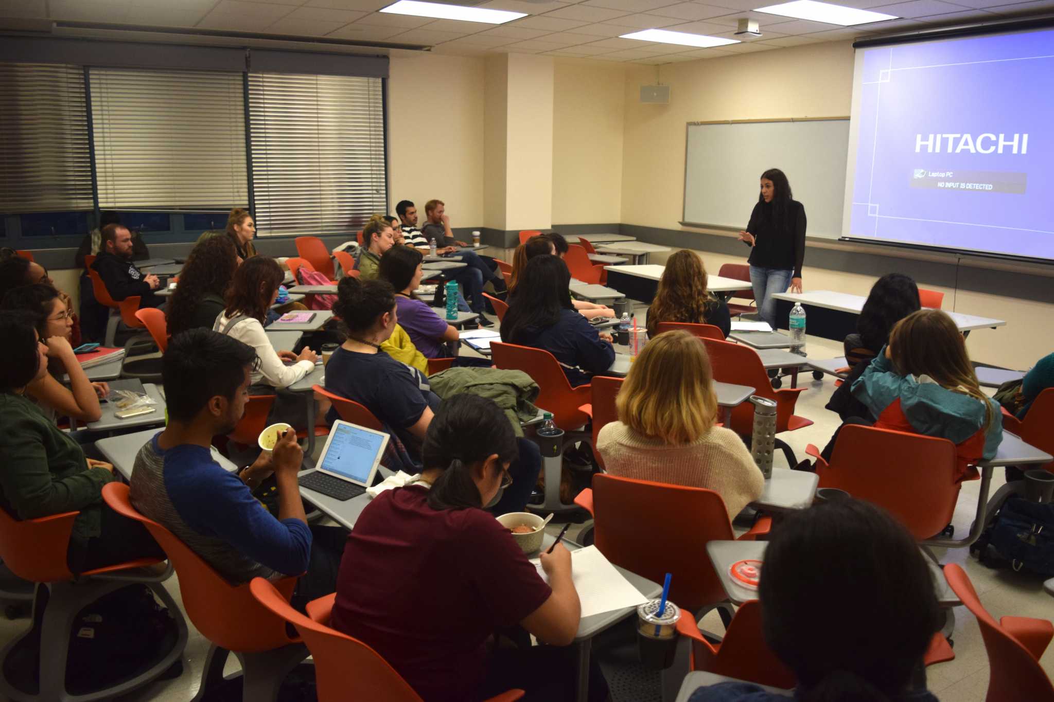 BE Foundation founder Karen Mercado speaks to a full classroom in the Humanities
Building on Thursday, Oct. 27, 2016. (Eric Chan / Xpress)