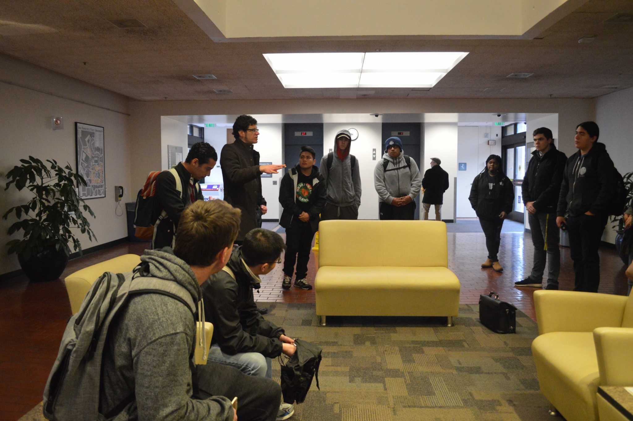 Robert Ovetz addresses a group of CASHH members in the lobby of the administration building on campus on Thursday, December 8, 2016. (Photo: Jacqueline Haudek)
