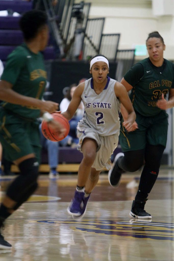 SF State Gators’ junior guard Toni Edwards (2) drives the ball down the court during the Gators 59-43 loss to the Cal Poly Pomona Broncos at The Swamp on Dec. 2, 2016.