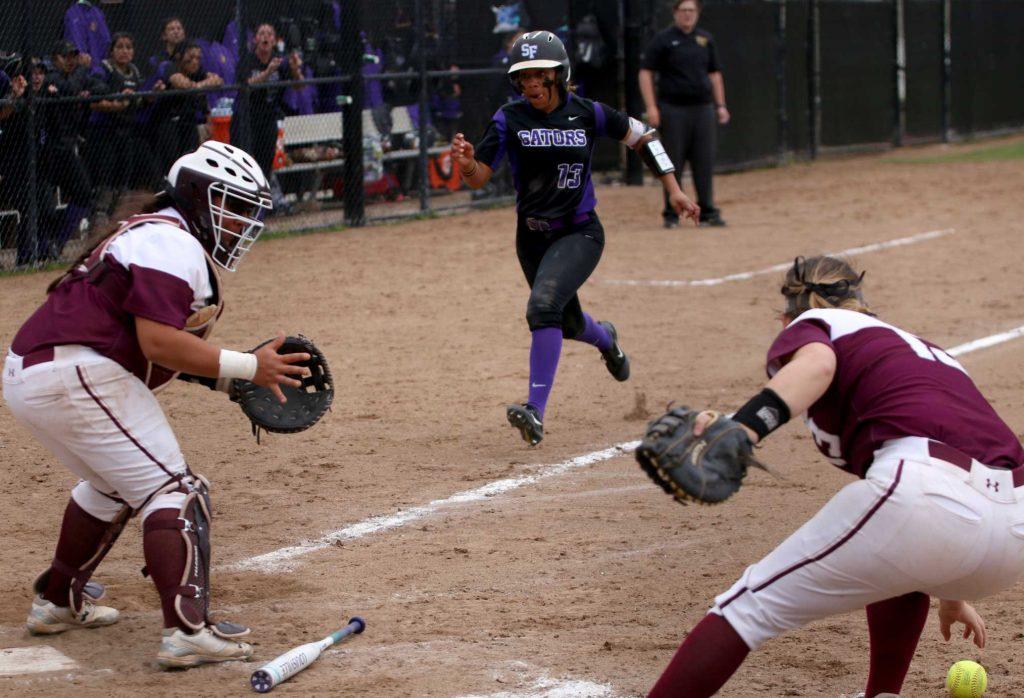 SF State Sophomore, INF, Madison Collins (13), runs towards home base as the gators rally to come back from two runs in the bottom of the 4th against the Chico State Wildcats at SF State on March. 15, 2017. (Kyler Knox/Xpress)