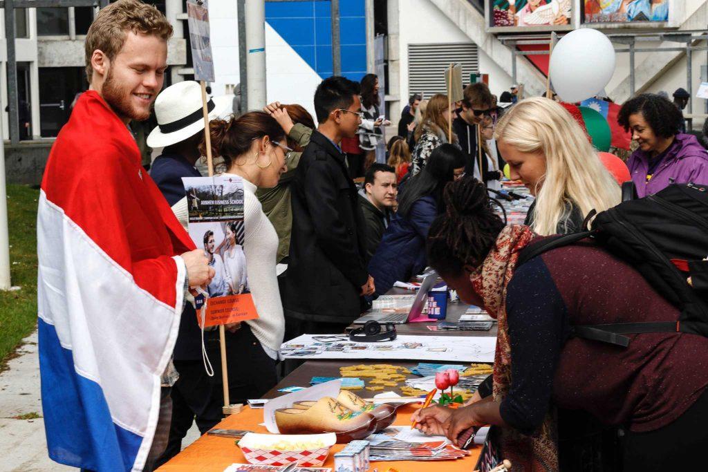 Exchange student and artificial intelligence major Sierk Kanis, 23, talks with two students about the Netherlands at the Study Abroad event held in the quad outside Cesar Chavez Center at SF State on April 12, 2017, in San Francisco, Calif. (Mason Rockfellow/Xpress)