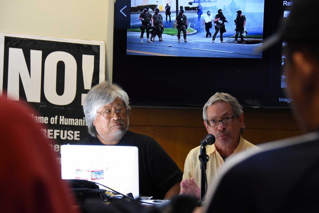 Daniel Phil Gonzales (L), professor of Asian American studies, and James Quesada (R), professor and department chair of anthropology, speak against fascism at the NO! Refuse Fascism teach-in at SF State on Tuesday, April 25, 2017. (Tate Drucker/Xpress)