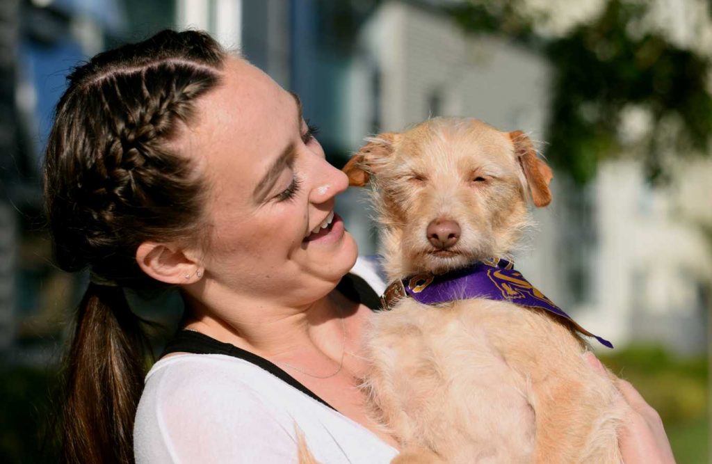 Ali Simonson, a freshman from San Diego, poses with her dog of 3 years, Bella, outside of her dorm at the Village at Centennial Square on Sunday, April 9, 2017 (Lauren Hanussak/Xpress).