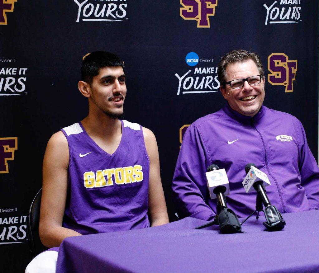 (L-R) Aj Kahlon (24) and Head Coach Paul Trevor talk to ABC, NBC, and KTVU during a press conference in the hallway of The Swamp at SF State on March 2, 2017 in San Francisco, Calif. (Mason Rockfellow/ Xpress)