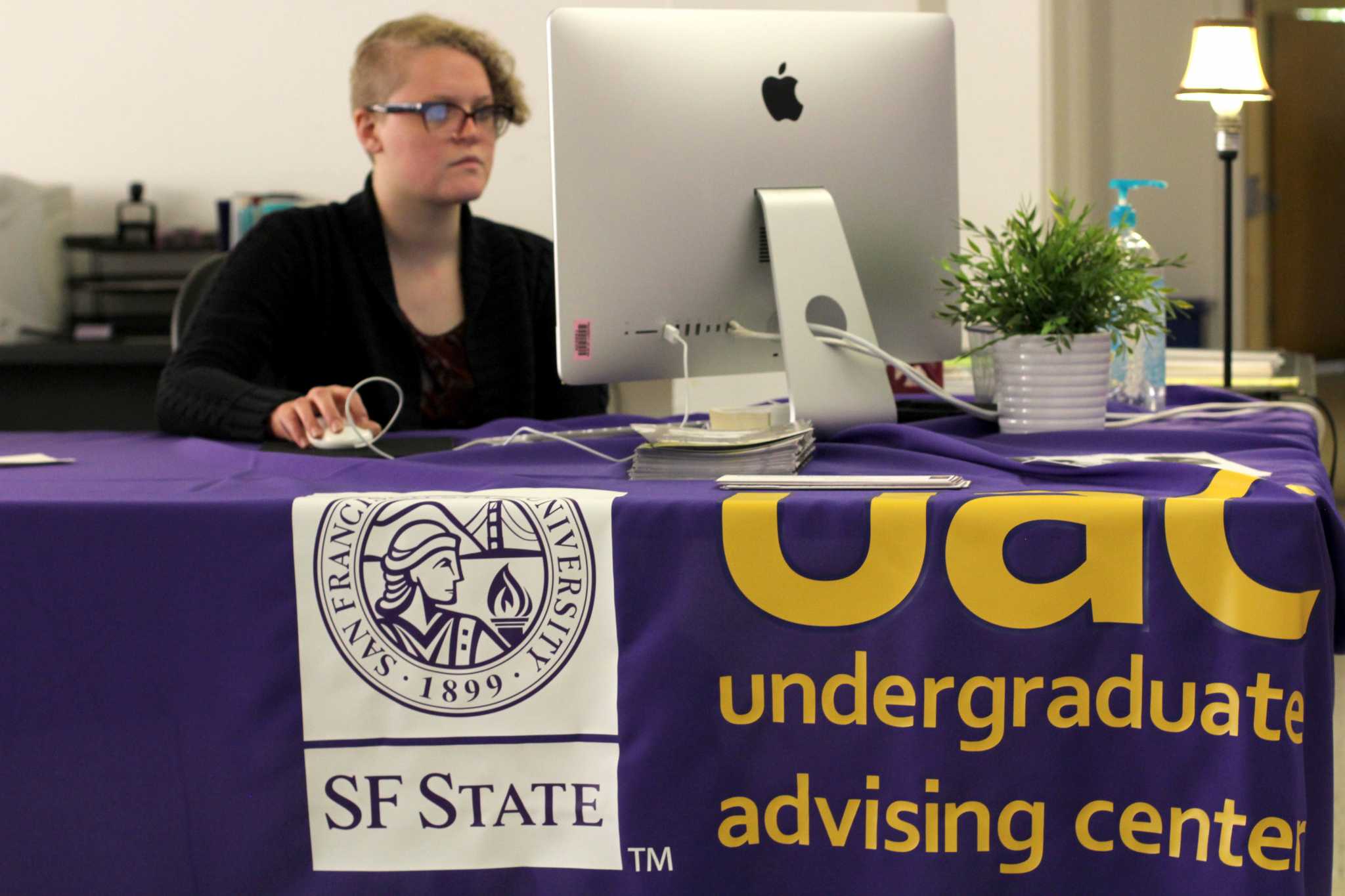 Graduation specialist, Revae Hitt, works in the Administration building at SF State on Tuesday, May 11, 2017. (Alina Castillo/Xpress)