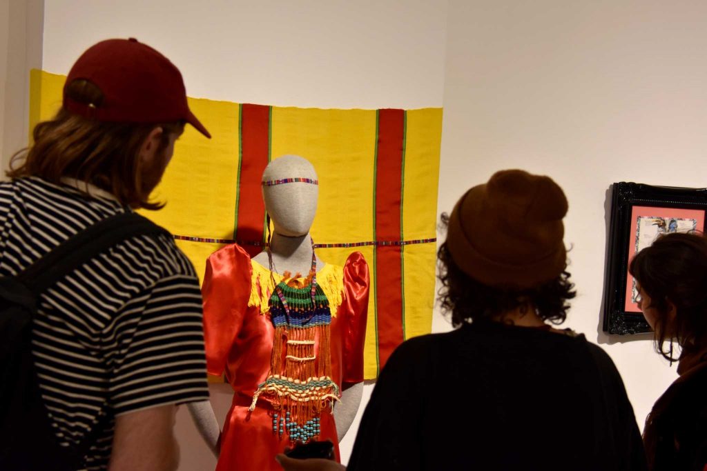 Students look at the art displayed at the ASI Art Gallery at SF State on April 27, 2017. (Tate Drucker/Xpress)