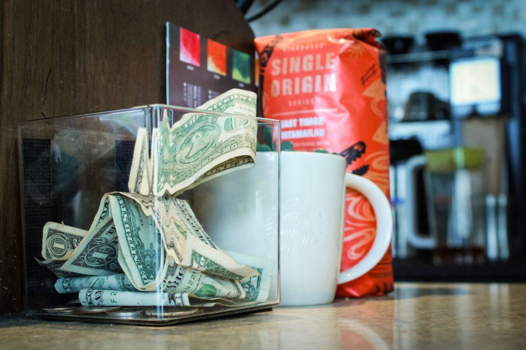 A tip jar is left on the counter at a Starbucks coffee shop on Monday, September 4, 2017. (Kayleen Fonte/Golden Gate Xpress)