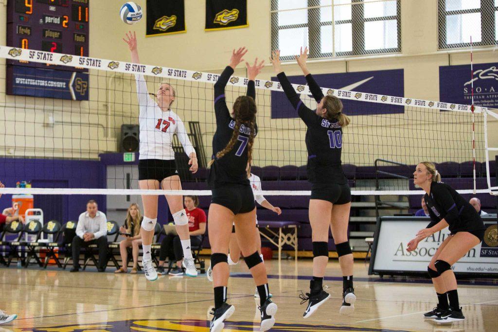 Biola University’s Bekah Roth (17) spikes the ball during a game against SF State in the gym on Thursday, September 7, 2017. Biola defeated SF State 3-1. (Travis Wesley/Golden Gate Xpress)