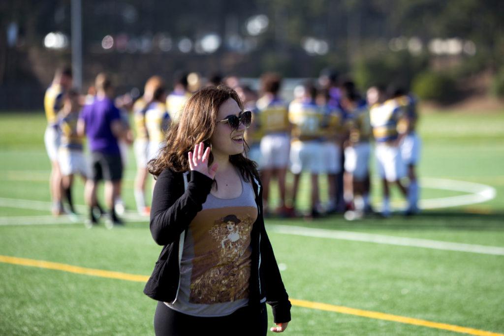 Hailey House, captain of the SF State women’s rugby team, waves to teammates at Gellert Field in Daly City on Saturday, Feb. 10, 2018. (Travis Wesley/Golden Gate Xpress)