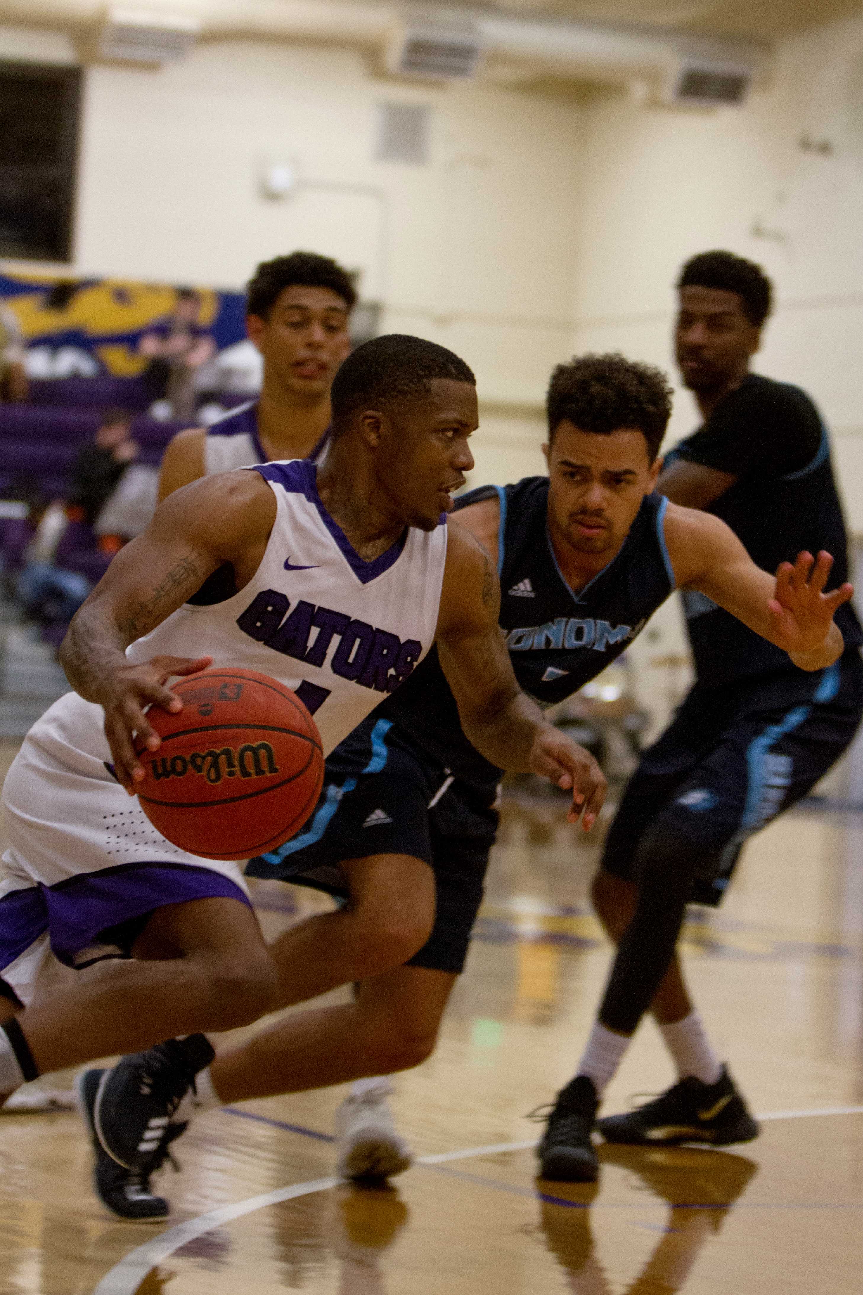 SF States Warren Jackson (1) tries to get past Sonoma States Brandon Tillis (2) to score during the game at SF State on Saturday, Feb. 10, 2018. (Joey Vangsness/Golden Gate Xpress)