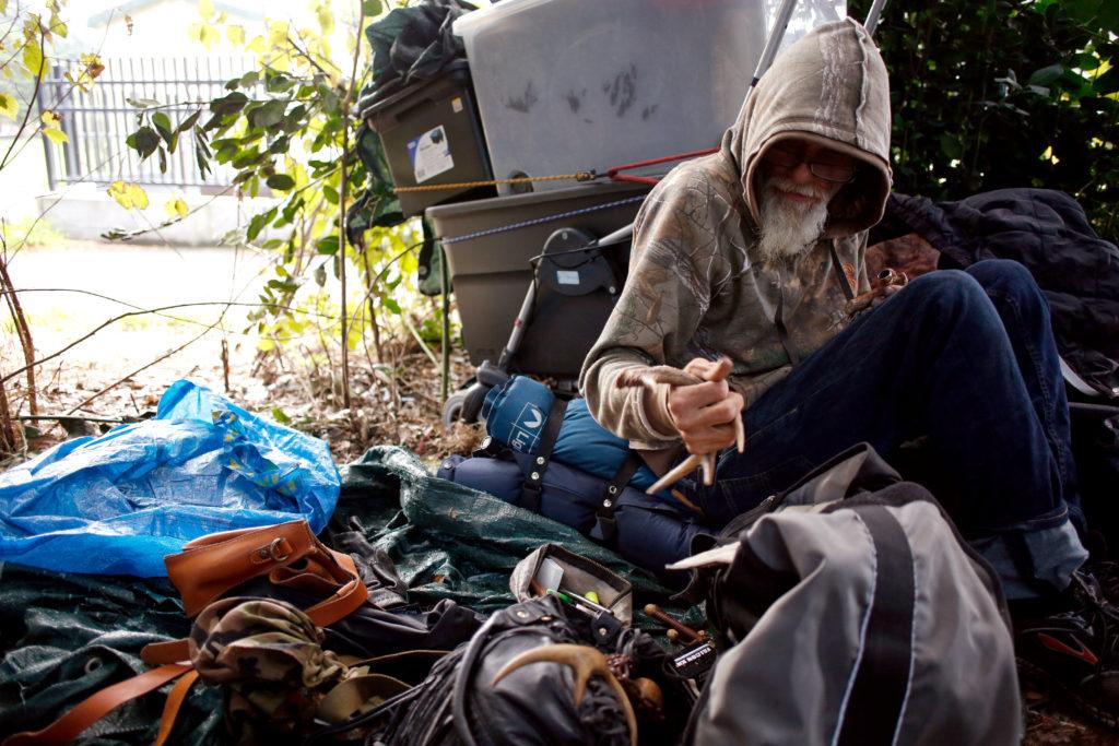 Mike Rinebold begins to pack his belongings before leaving his camp site near Hippie Hill in Golden Gate Park on Saturday Nov. 11, 2017. (Niko LaBarbera/Golden Gate Xpress)