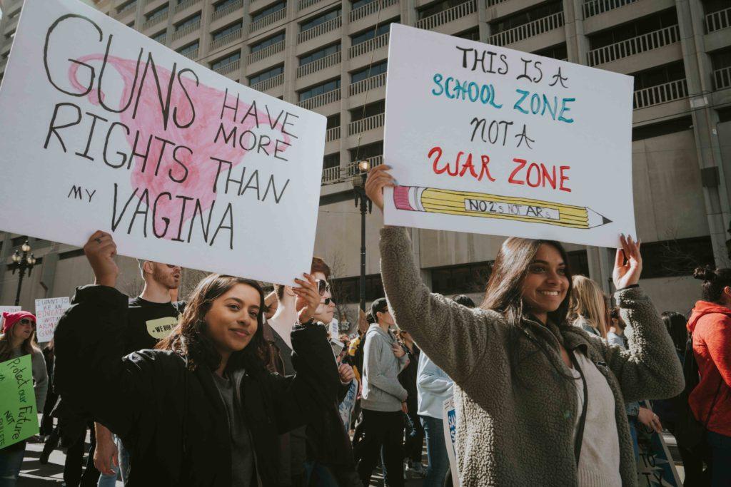 Two girls participate in the March for our Lives protest in San Francisco, Calif. on Saturday, March 24, 2018. Hundreds of thousands marched in the nationwide protests advocating for gun control and school safety after the killing of 17 students at Stoneman Douglas High School in Parkland, Florida on Feb. 14. (Photo by Sarahbeth Maney)