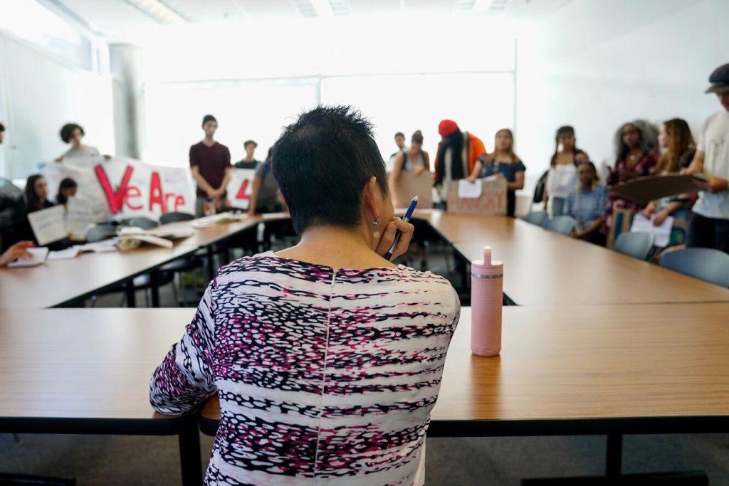 Luoluo Hong listens to students grievances regarding the administration’s lack of effort in combating the food insecurity issue on SF State campus on Thursday, March 29. The meeting took place after students occupied the fourth floor of the Student Services building until Hong agreed to meet with students. (Amarah Hernandez/Golden Gate Xpress)