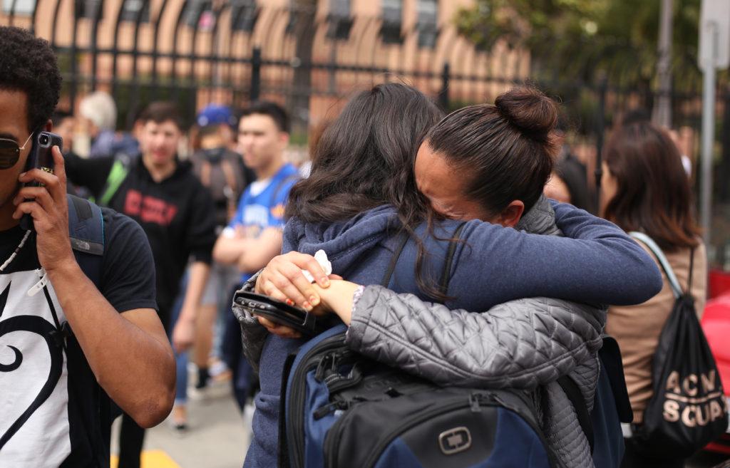 Balboa High School student Carolina Mendiola and her mother Teresa embrace after Carolina was released from the school following a lockdown due to reports of a shooting on campus in San Francisco, Calif., on Thursday, Aug. 30, 2018. (Christian Urrutia/Golden Gate Xpress)