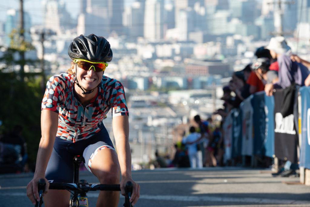 Hanna Muegge finishes with a big smile as she earns first place in the San Francisco Red Bull Bay Climb WomenÕs Open on Saturday, Sept. 8. (David Rodriguez/Golden Gate Xpress)