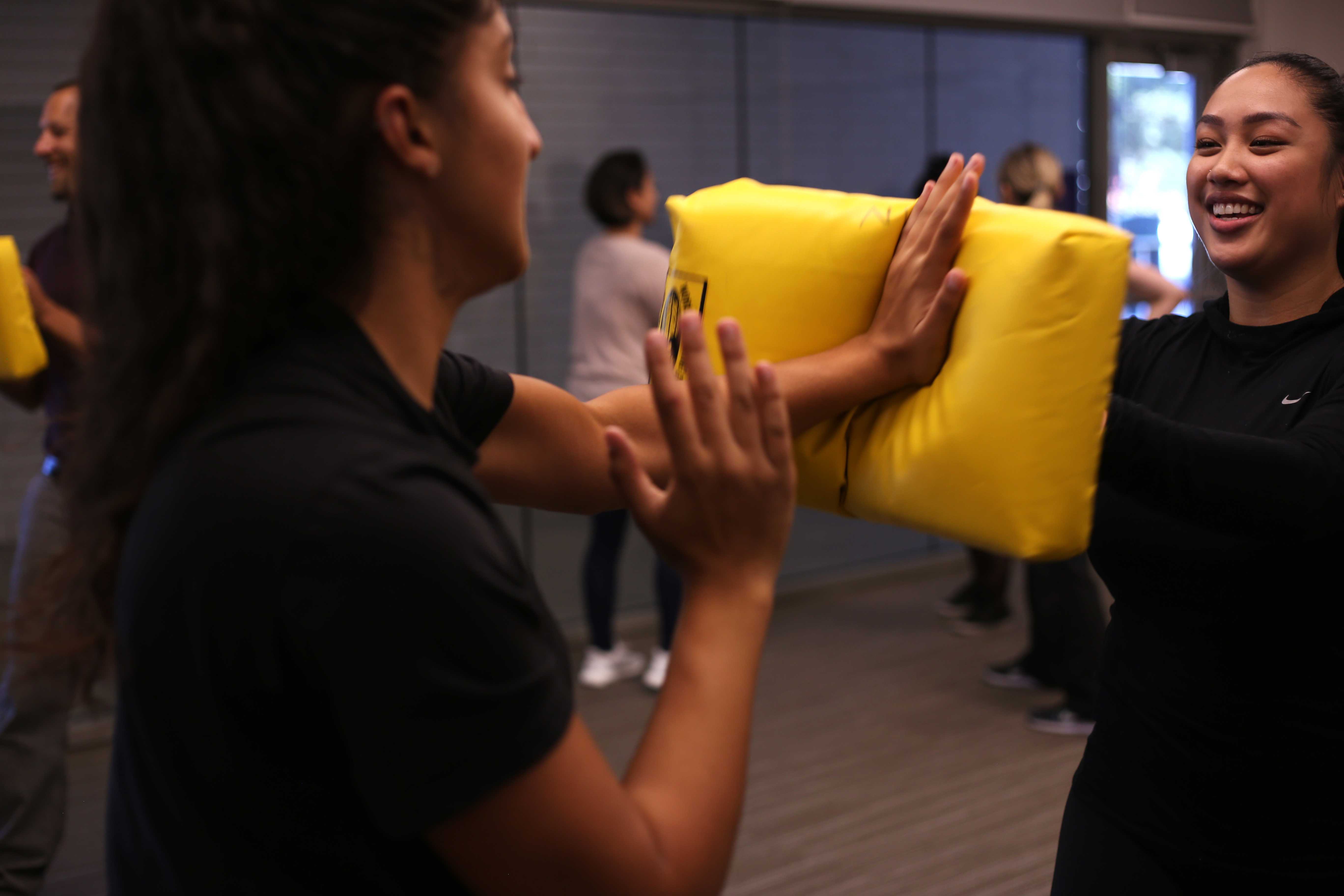 Biology major Shannon Changizi and Vanessa Mariano, a business management major, practice a striking technique during the self-defense workshop at the Mashouf Center on Wednesday, Sept. 19. (Christian Urrutia/Golden Gate Xpress)
