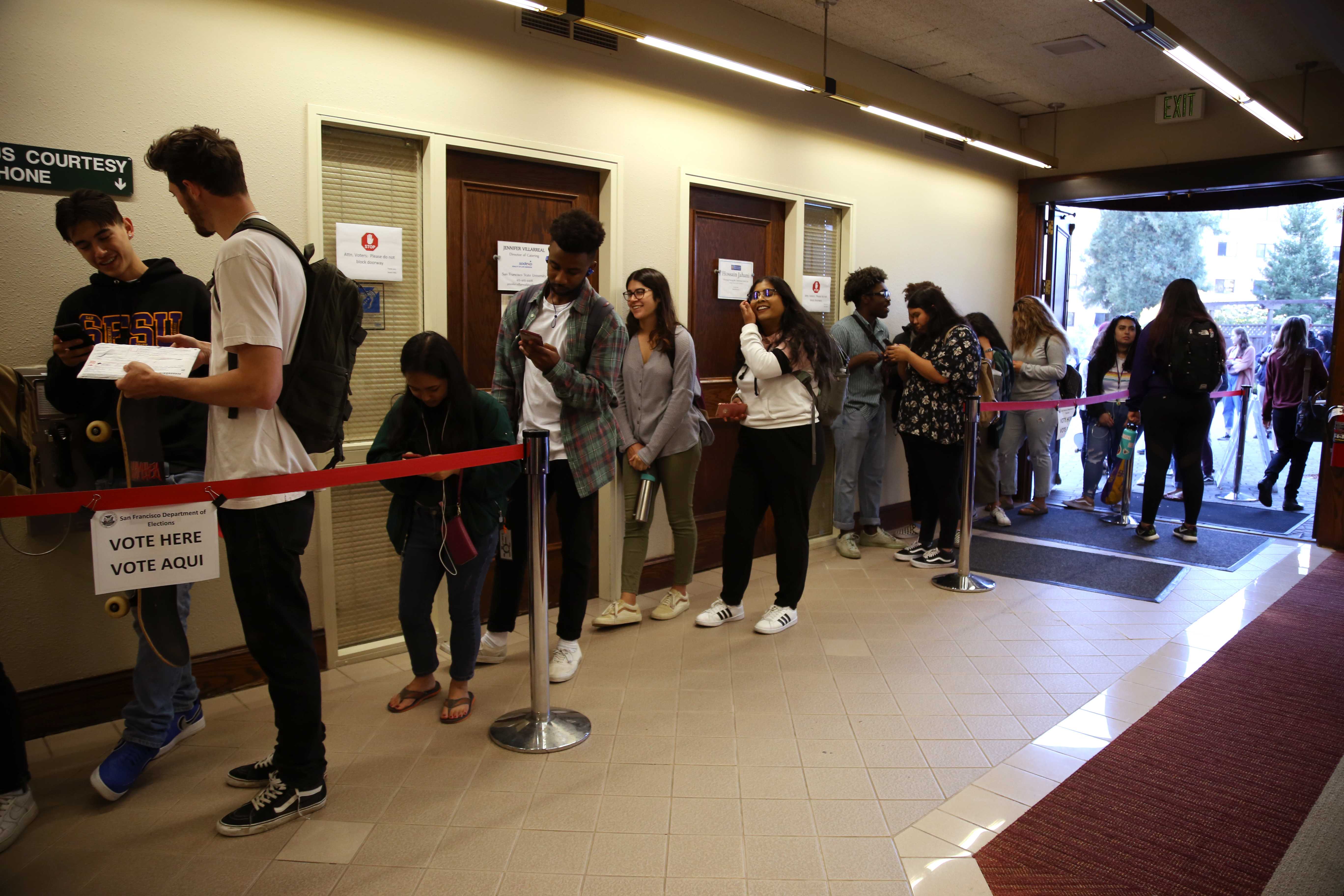 People wait in line at SF States Seven Hills Conference Center to cast their votes in the Midterm Elections on Tuesday, Nov. 6, 2018. Some students waited in lines for three hours to cast their votes. (Mira Laing/Golden Gate Xpress)