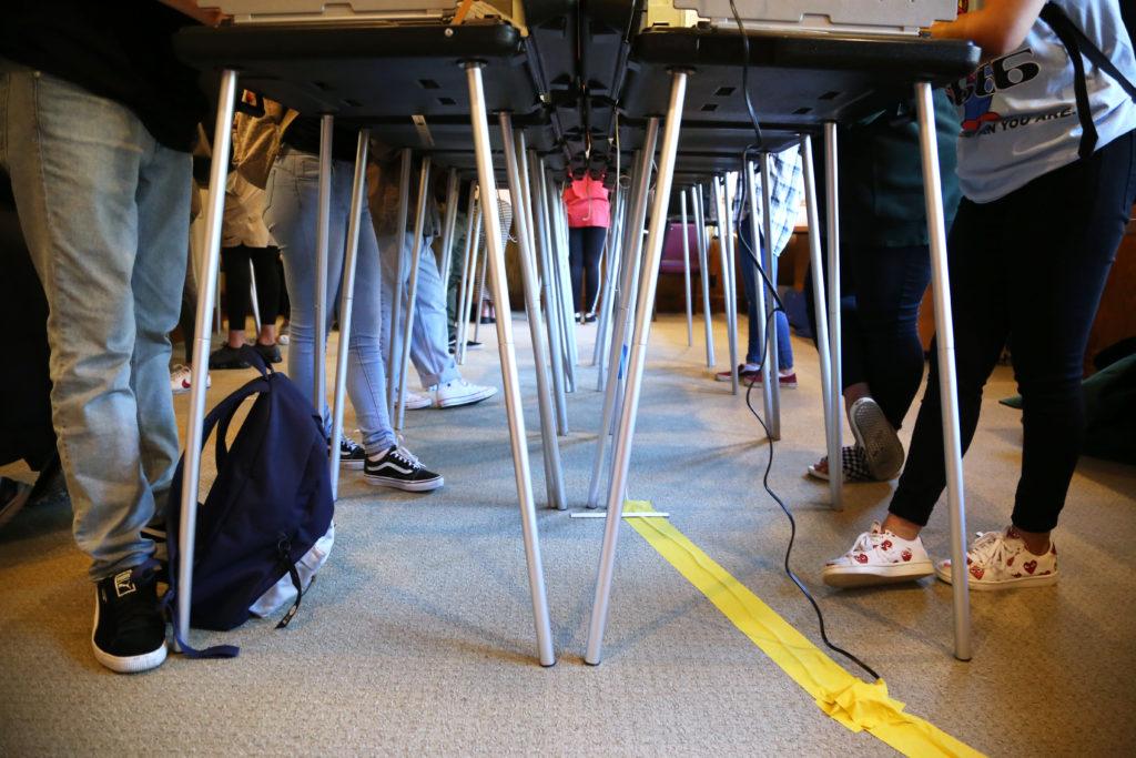 People cast their votes in the Midterm Elections at SF States Seven Hills Conference Center on Tuesday, Nov. 6, 2018. Some students waited in lines for three hours to cast their votes. (Mira Laing/Golden Gate Xpress)