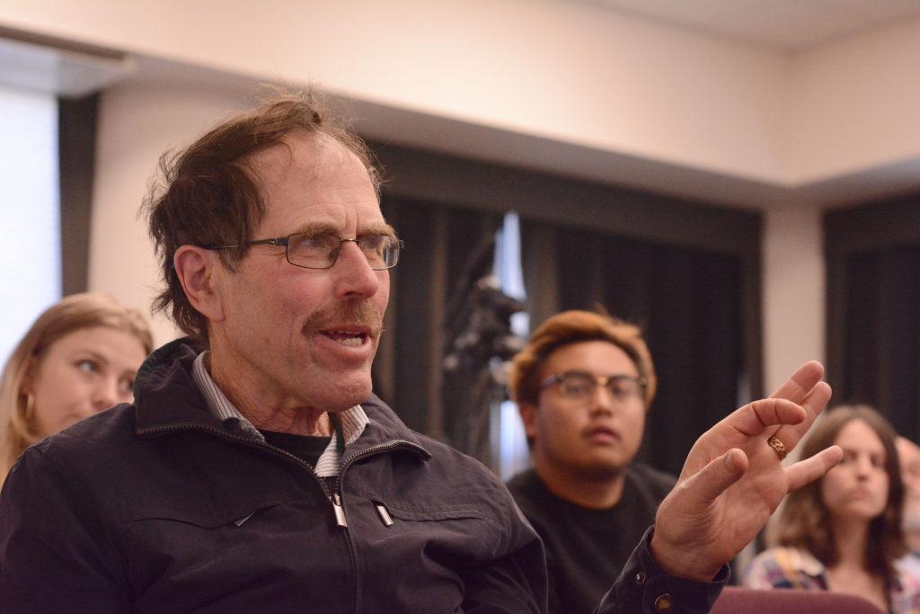 Lee Heidhues, a former journalist on The Gator newspaper and 1969 SFSU alumnus, asks a question to a panel of Xpress editors during the SFSU journalism department's event commemorating the fiftieth anniversary of the 1968 Strike at SF State in San Francisco, Calif. on Wednesday, Nov. 14, 2018. (Aaron Levy-Wolins/Golden Gate Xpress)