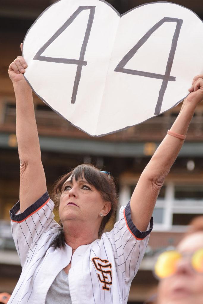 Bernadette Bay, 61, holds a large heart with the number 44, in honor of Willie McCoveys jersey number, at McCoveys celebration of life at AT&T Park in San Francisco, Calif., on Thursday, Nov. 8, 2018. The former Giants hall of fame slugger, Stretch, who hit 521 home runs and 18 grand slams, died at 80 on Oct. 31.