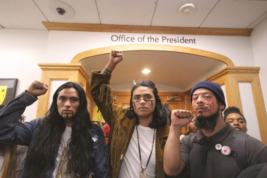(L-R) Raphael Clark-Faust, Gabriel Clark-Faust, and Rogelio Martin stand in front of the presidents office during a walkout in honor of the 68 strikers at SF State on Thursday November 8, 2018. © (Oscar Rendon/GoldenGateXpress)