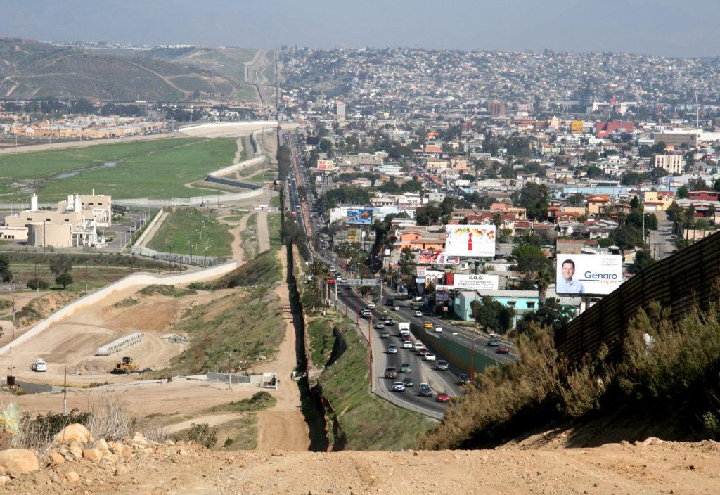 A+small+fence+separates+densely+populated+Tijuana%2C+Mexico%2C+right%2C+from+the+United+States+in+the+Border+Patrol%C2%92s+San+Diego+Sector.++Construction+is+underway+to+extend+a+secondary+fence+over+the+top+of+this+hill+and+eventually+to+the+Pacific+Ocean.