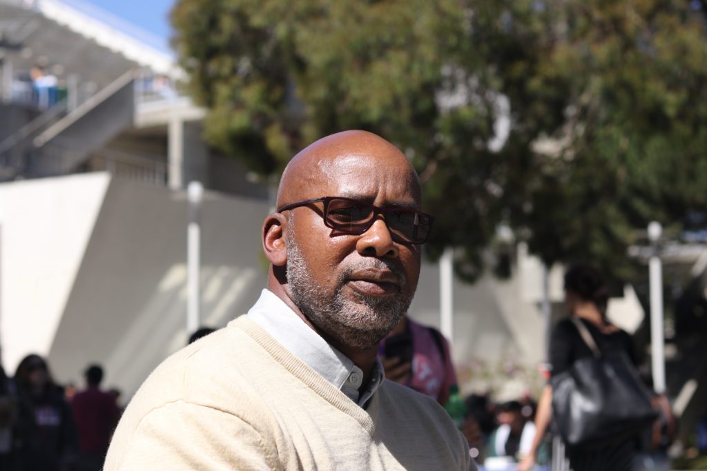 Orlando Harris, Director of Career Services and Leadership Development, has his portrait taken near Malcolm X Plaza at SF State's on Sept. 10, 2018. (Oscar Rendon/Golden Gate Xpress)