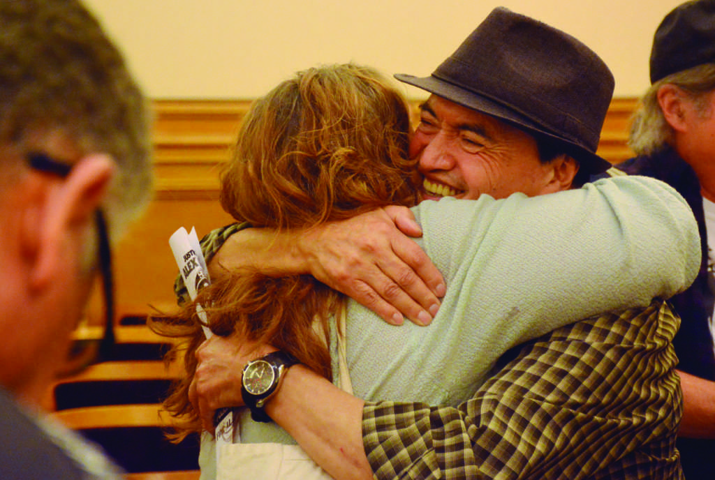 Alexs father, Regugio Nieto, hugs Jennifer Raviv after the decision was made to build a memorial with the proper language to remember Alex Nietos death in Bernal Heights, where he was shot 59 times by police officers in 2019. Photo by Tristen Rowean.