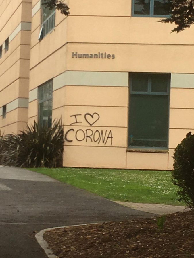 Visuals of the phrases I love Corona spray painted on the Humanities Building at SF State on March 16. 2020 was one of multiple phrases in black graffiti seen across campus Monday morning. (Paisley Trent / Golden Gate Xpress)