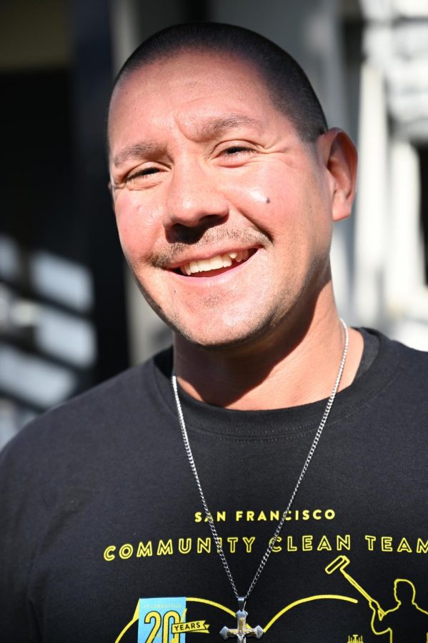 J Vasquez smiles for a photo outside of the Project Rebound office in the Cesar Chavez building on March 9, 2020. 