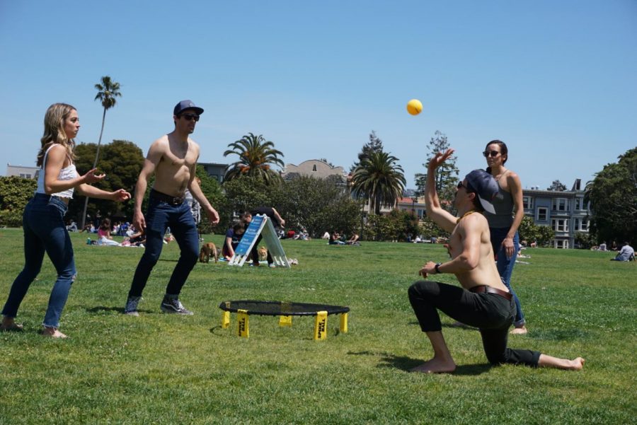 People play a game of Spikeball together without face coverings in Mission Dolores Park in San Francisco on May 9, 2020.