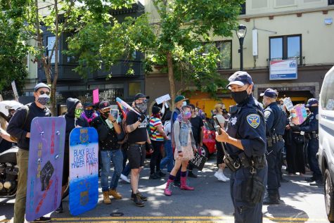 Protestors confront SFPD on Valencia street during the Pride is a Riot in San Francisco, Calif. on June 17, 2020 (Daniel Da Silveira / Golden Gate Xpress)