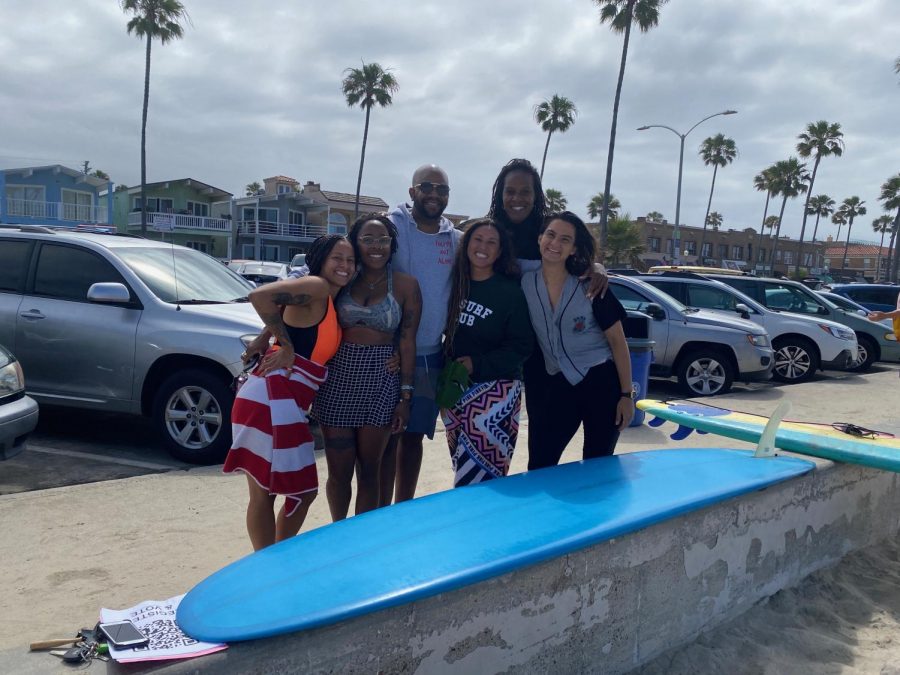 (Right to left) Gianné Nascimento, Toni Lynn Arzu, Jonathan Curtis, Vanessa Yeager, Joi K. Madison and Chase Bucklew gather in the parking lot after the paddle out. Surfers in Newport Beach organized a paddle out Saturday morning in honor of George Floyd